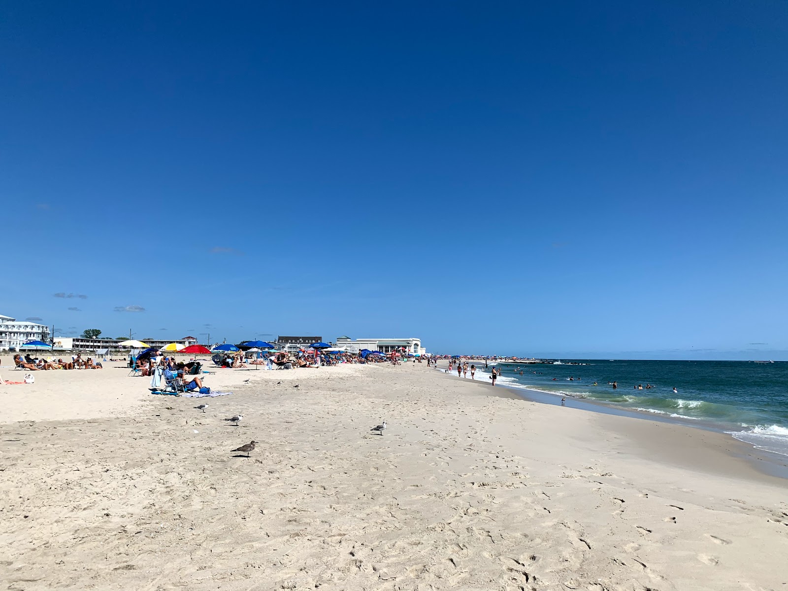 Cape May Beach NJ'in fotoğrafı parlak kum yüzey ile