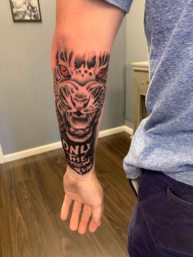 Explore cupid tattoo ideas, creative tattoo ideas in Gadsden, available at Zekez Inkz Tattoos & Piercings