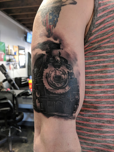 Explore music tattoo ideas, creative tattoo ideas in Colorado Springs, available at Fallen Heroes Tattoo & Piercing (Colorado)