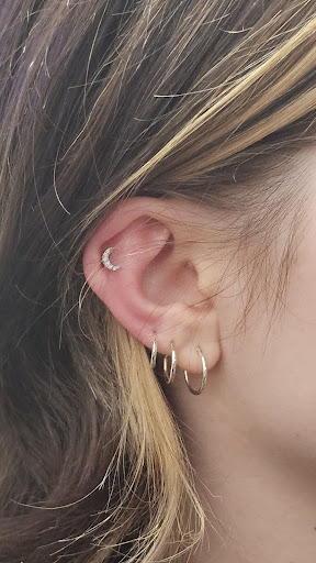 Explore cute ghost tattoo ideas, creative tattoo ideas in Marysville, available at Hawaiian Touch Piercing Co.