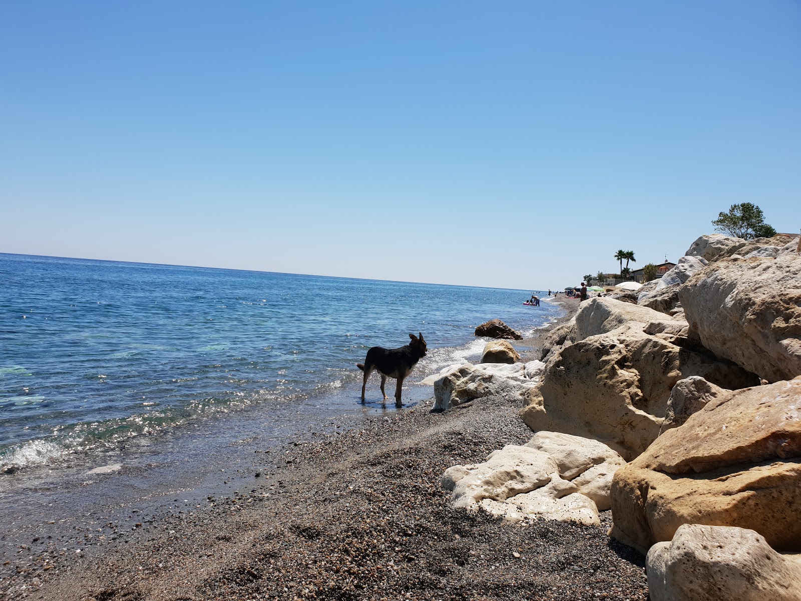 Foto av Mirto Beach med lång rak strand
