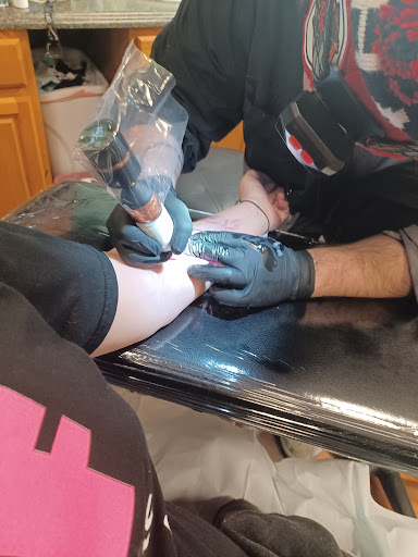 Explore forearm cross tattoo ideas, creative tattoo ideas in Pueblo, available at Spellbound Electric Tattoos