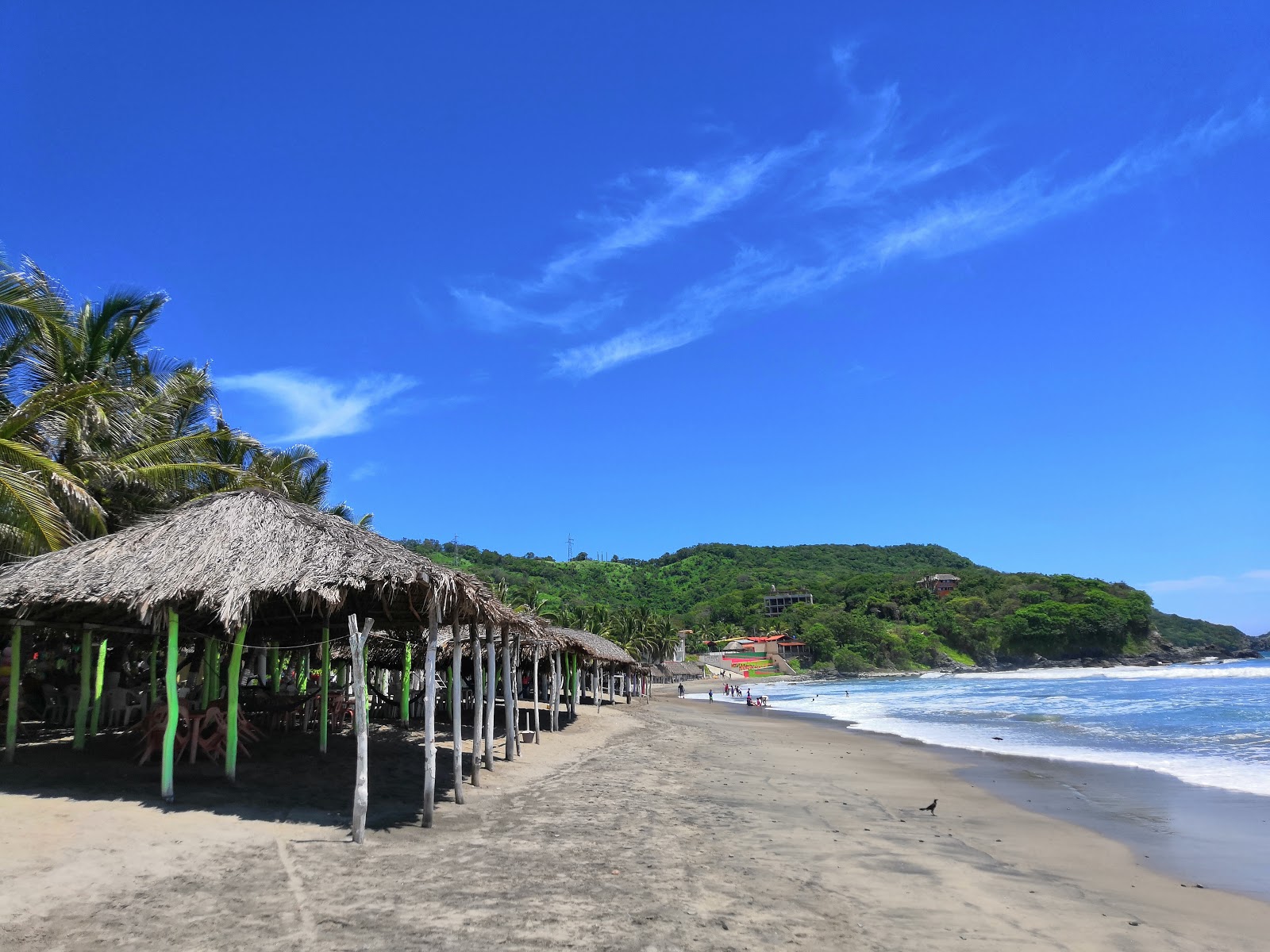 Photo de Playa Ojo De Agua avec l'eau turquoise de surface