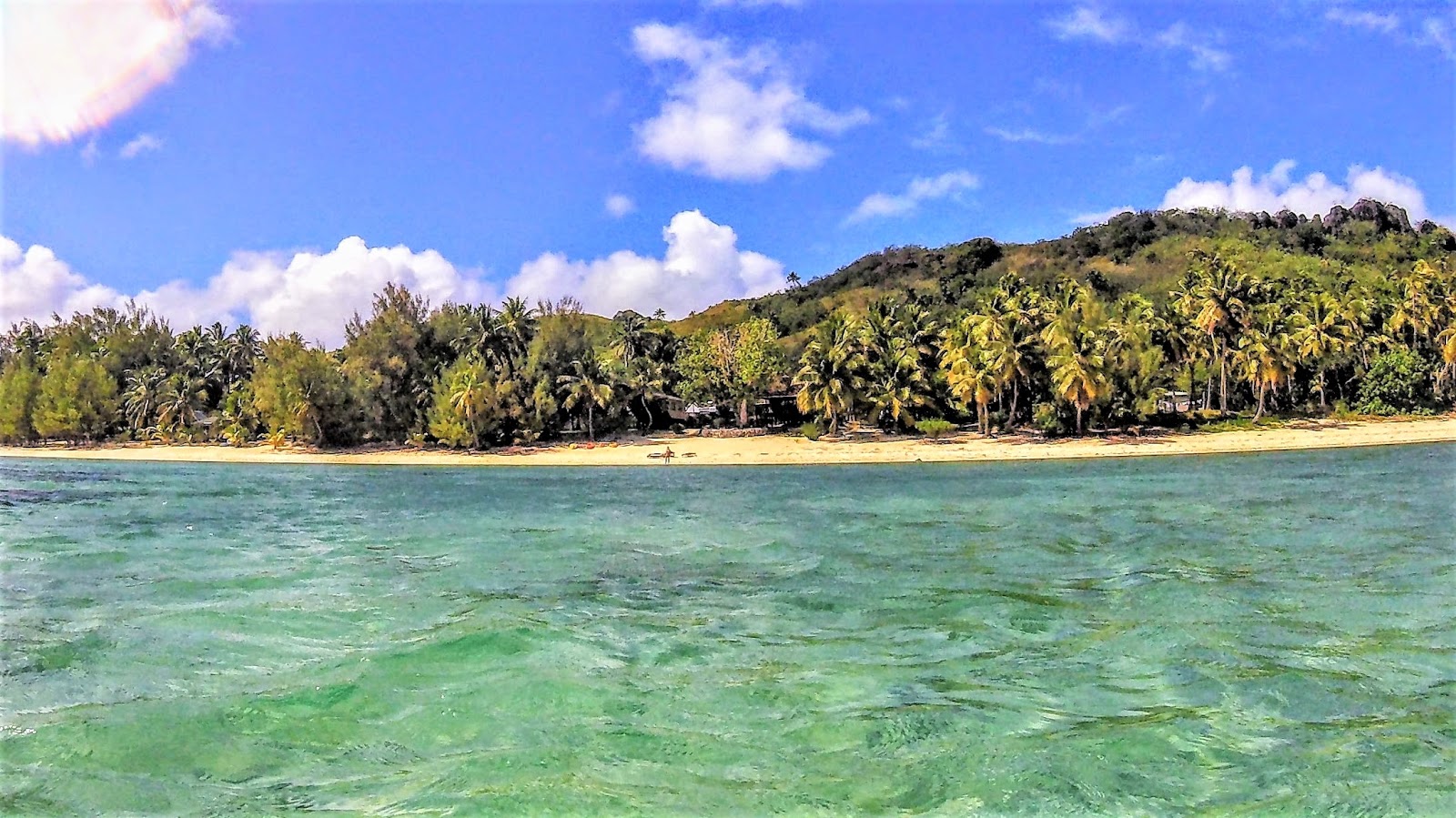 Fotografija Aitutaki Beach z dolga ravna obala