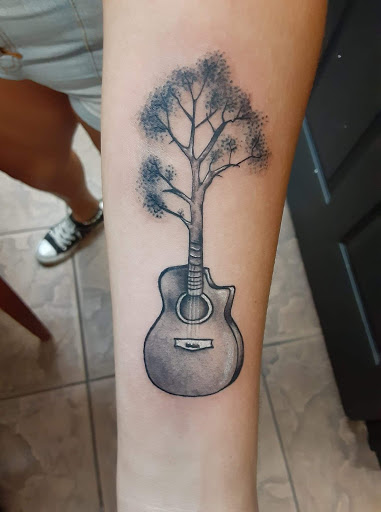 Explore strawberry tattoo ideas, creative tattoo ideas in Okeechobee, available at Muck City Tattoos & Piercings