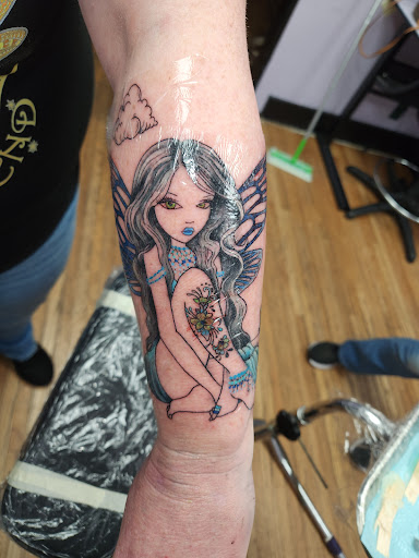 Explore sunflower and roses tattoo ideas, creative tattoo ideas in Columbus, available at Sweet Baby Octane