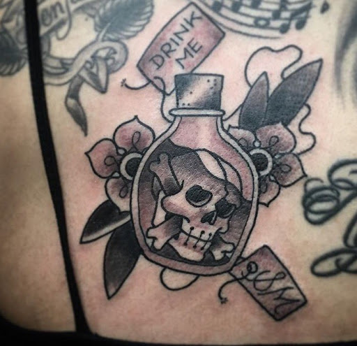 Explore cosmos flower tattoo ideas, creative tattoo ideas in San Diego, available at Sideshow Tattoo and Piercing