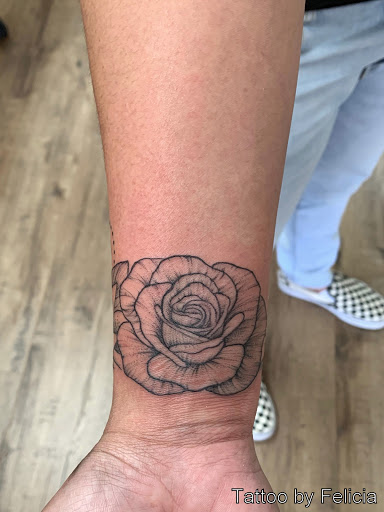 Explore red tattoo ideas women, creative tattoo ideas in Fort Myers, available at Tiger Lotus Tattoo and Piercing