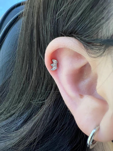 Explore side hand tattoo ideas, creative tattoo ideas in Orange, available at Baron Art Tattoo