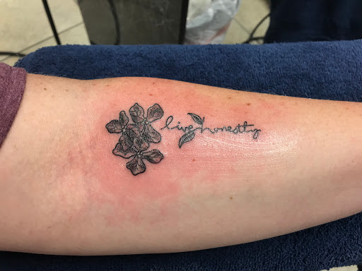 Explore never give up tattoo ideas, creative tattoo ideas in Gulfport, available at Jack & Dianes Tattoo