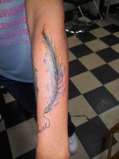 Explore upper arm tattoo ideas for men, creative tattoo ideas in Owosso, available at Twisted ink tattoo