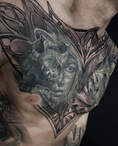 Explore tomahawk tattoo ideas, creative tattoo ideas in Ambler, available at Tattoo GalaxyAmbler Piercing & Custom Tattoos