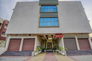 Super OYO Flagship 65290 Hotel Plus Corporate One image