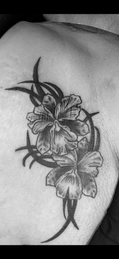 Explore spina bifida tattoo ideas, creative tattoo ideas in Rogers, available at Ink Solutions Tattoo