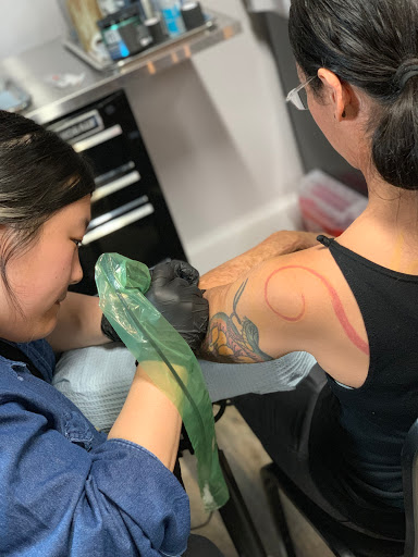 Explore black and white flower tattoo ideas, creative tattoo ideas in Arlington, available at Lady Octopus Tattoos