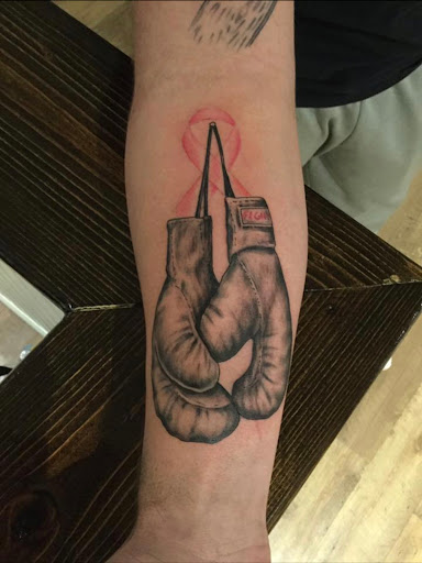 Explore vertical tattoo ideas, creative tattoo ideas in Overland Park, available at Talent Tattoo And Body Piercing