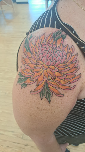 Explore purple flower tattoo ideas, creative tattoo ideas in Durham, available at Welcome Tattoo