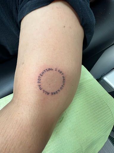 Explore middle of boob tattoo ideas, creative tattoo ideas in Peoria, available at The Ink Bar