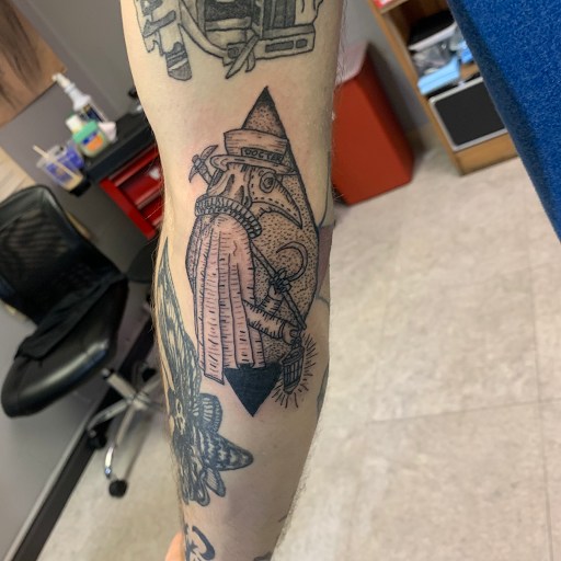 Explore wrestling tattoos ideas, creative tattoo ideas in Hudson Falls, available at ALTERED ADDICTION TATTOOS