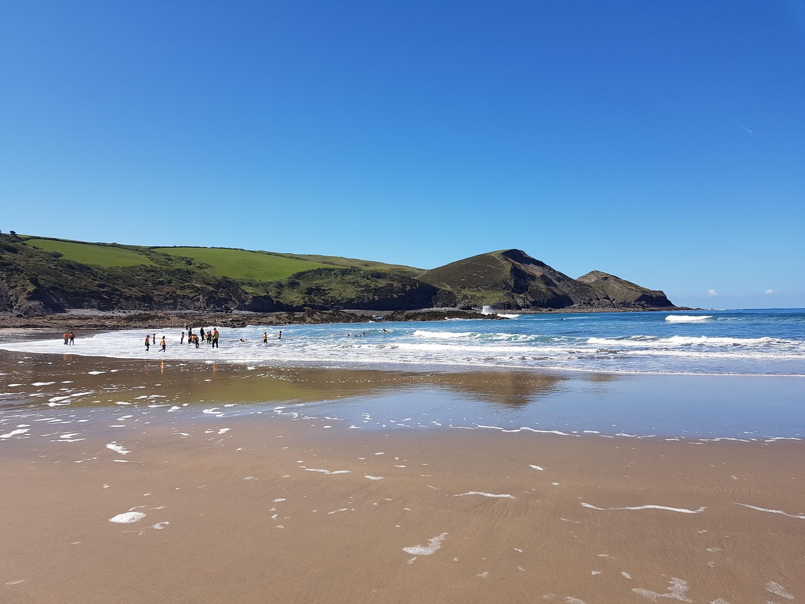 Foto af Crackington beach med gråt sand og småsten overflade