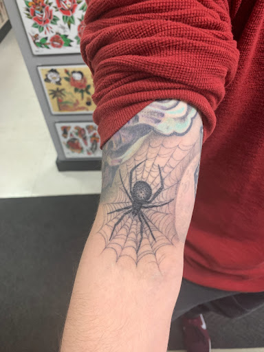 Explore postage stamp tattoo ideas, creative tattoo ideas in Dover, available at Good Looks Social Tattoo Club