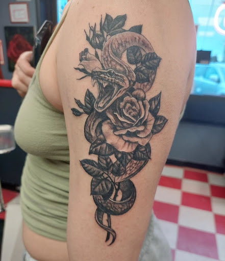 Explore black and white sleeve tattoo ideas, creative tattoo ideas in Ambler, available at Tattoo GalaxyAmbler Piercing & Custom Tattoos