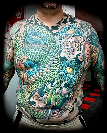 Explore nigerian tattoo ideas, creative tattoo ideas in Fort Payne, available at Broken Arrow Tattoo Co.