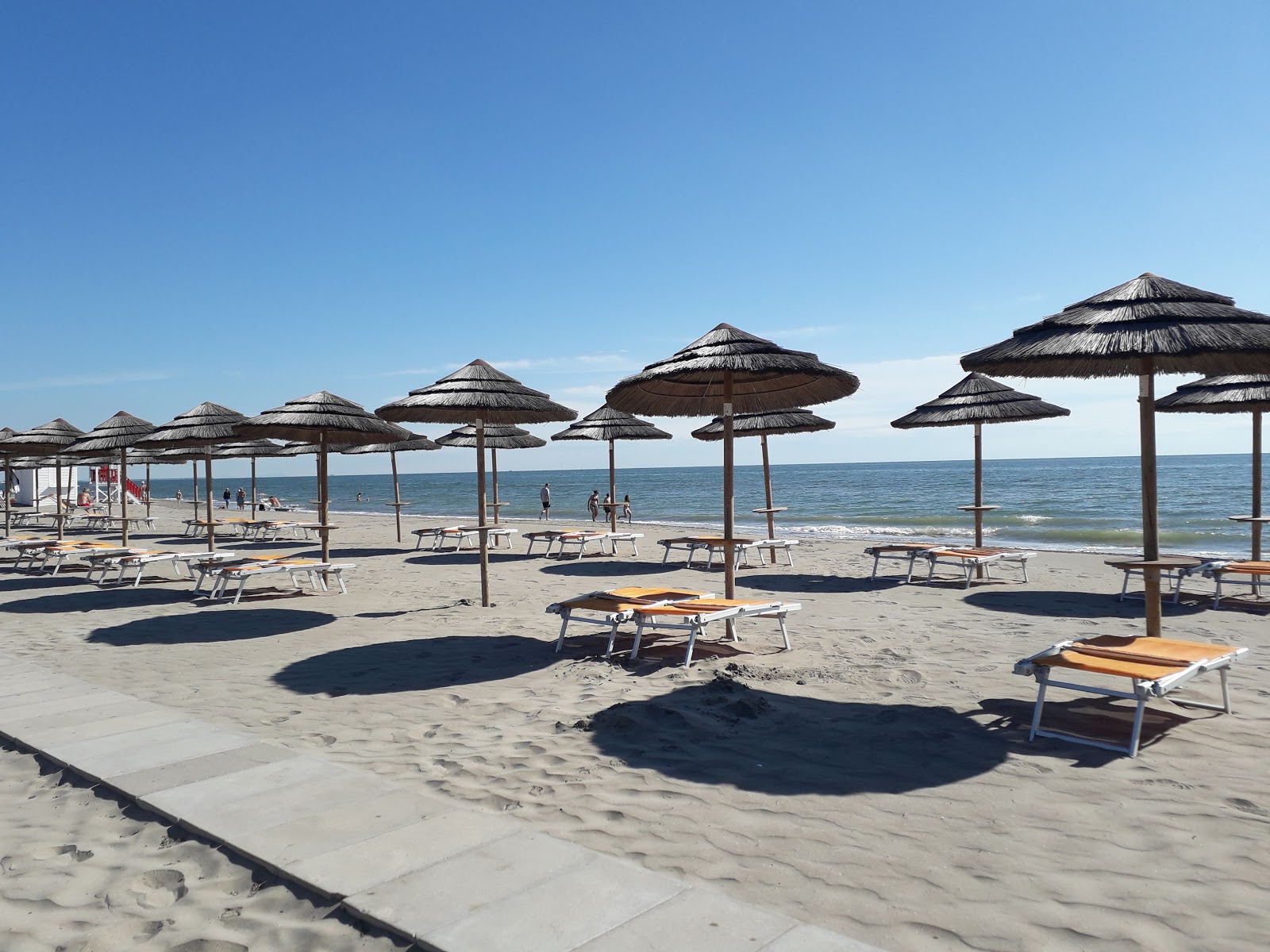 Photo de Spiaggia di Comacchio avec sable fin et lumineux de surface