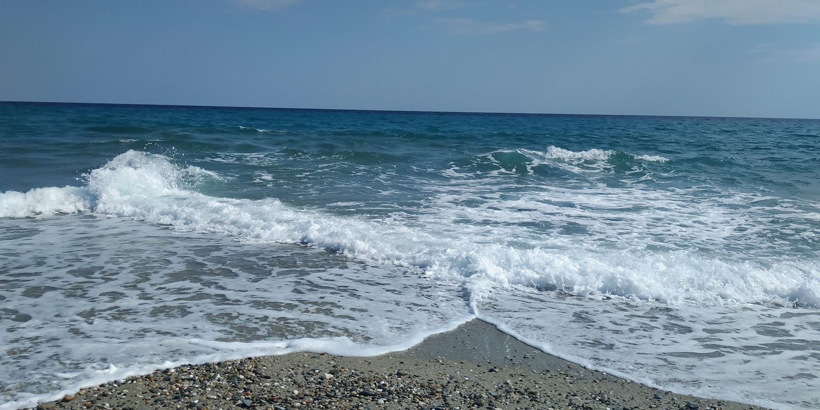 Foto de Praia de Possidi e o assentamento