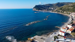 Agnone Beach'in fotoğrafı düz bir kıyı şeridi ile birlikte
