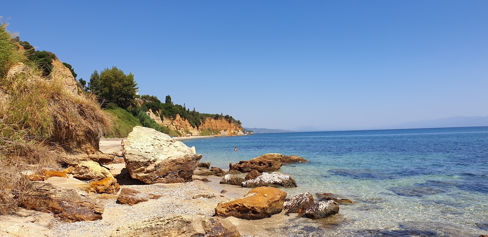 Photo of Agia Triada beach located in natural area