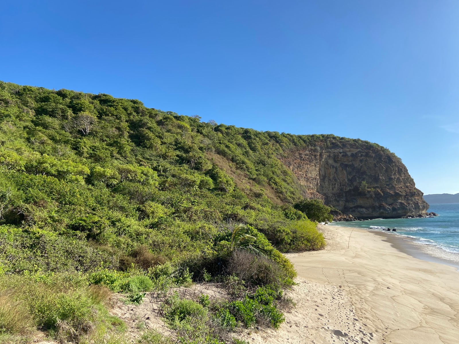 Fotografie cu Pendoek Beach cu o suprafață de nisip beige