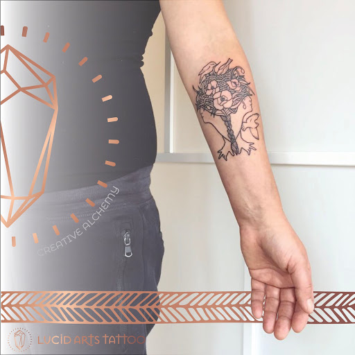 Explore ski mask tattoo ideas, creative tattoo ideas in Carefree, available at Lucid Arts - Design & Tattoo