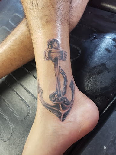 Explore moon tattoo ideas for guys, creative tattoo ideas in Daytona Beach, available at Studio 21 Tattoo & Piercings Daytona Beach