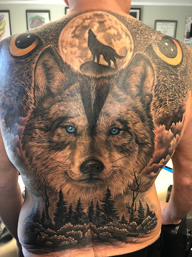 Explore rock and roll tattoo ideas, creative tattoo ideas in Englewood, available at Point of Entry Tattoo