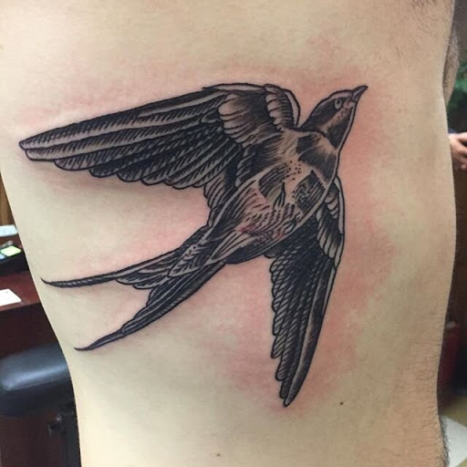 Explore dragon back tattoo ideas, creative tattoo ideas in Peoria, available at Hot Spot Tattoo and Piercing