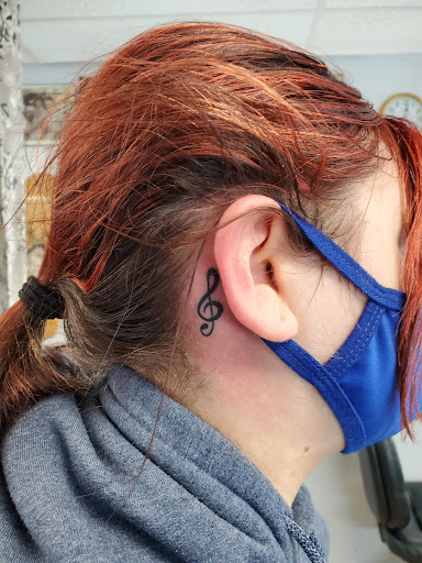 Explore small frog tattoo ideas, creative tattoo ideas in Buffalo, available at CowPok Piercing Tattoo Gallery