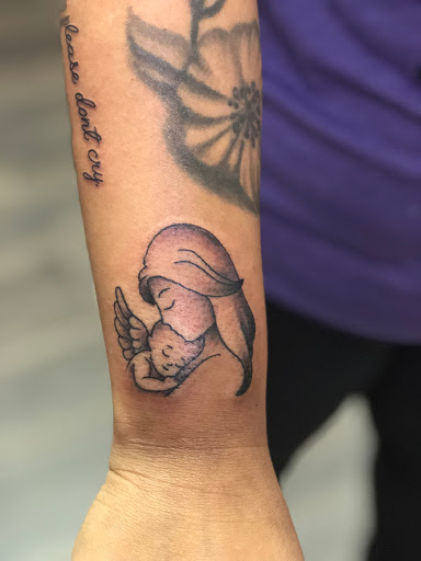 Explore ferret tattoo ideas, creative tattoo ideas in Sanford, available at Hudson & Company Tattoo Studio