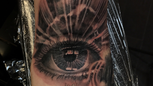 Explore skull tattoo sleeve ideas, creative tattoo ideas in Addison, available at Cat Tattoo