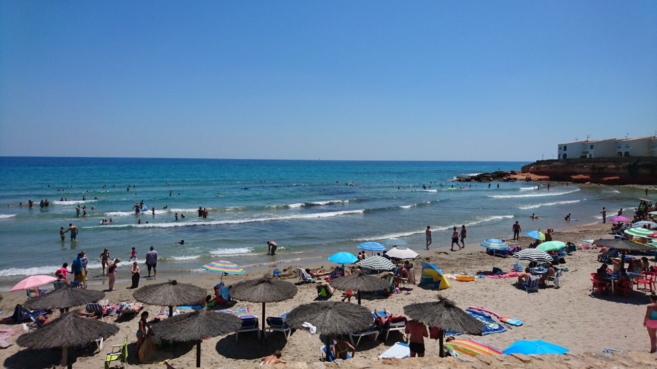 Foto di Spiaggia Flamenca e l'insediamento