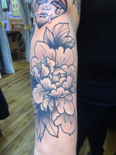 Explore marigold tattoo ideas, creative tattoo ideas in Peabody, available at Thousand Needles Tattoo