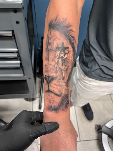 Explore flower name tattoo ideas, creative tattoo ideas in Foley, available at Symbolic Ink Tattoo Studio