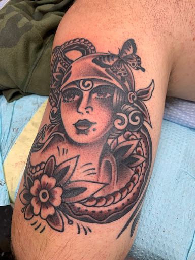 Explore tattoo ideas for females, creative tattoo ideas in Cranston, available at TomButts Tattoo LLC