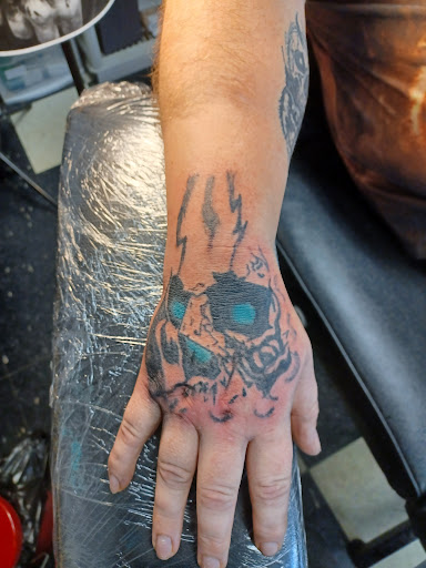 Explore cake tattoo ideas, creative tattoo ideas in Owosso, available at Twisted ink tattoo