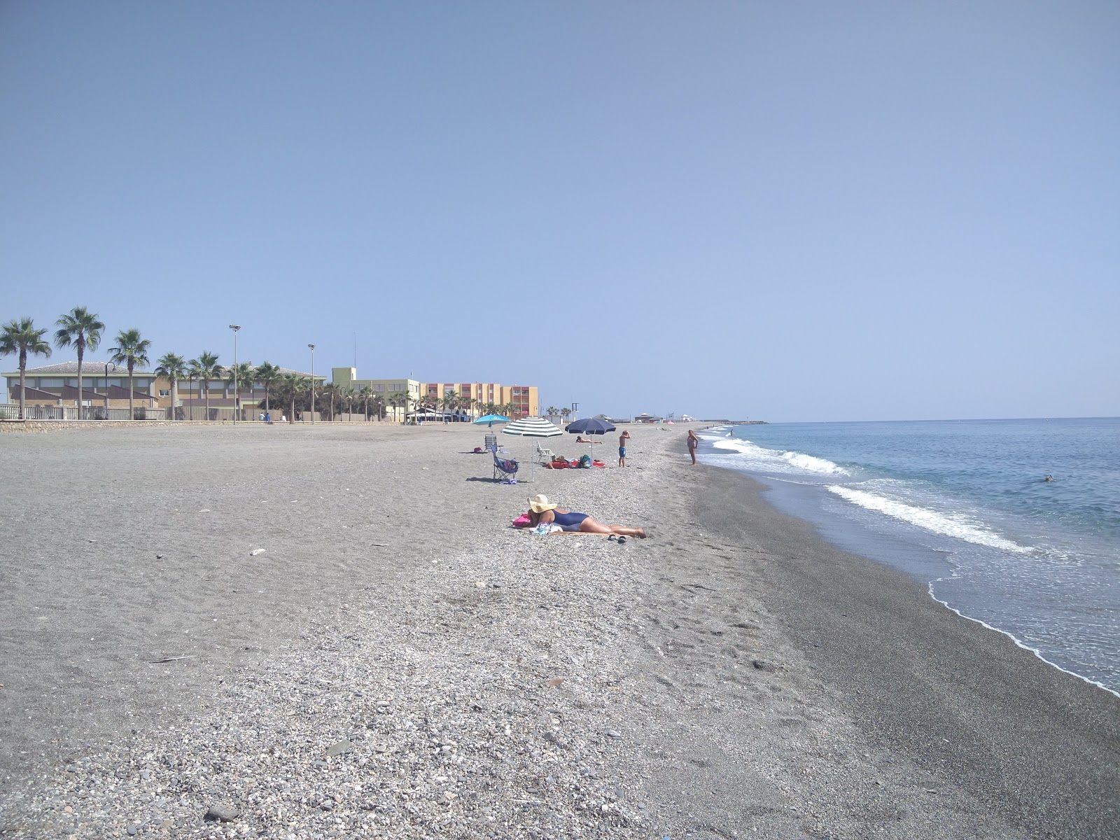 Foto van Playa de la Sirena Loca en de nederzetting