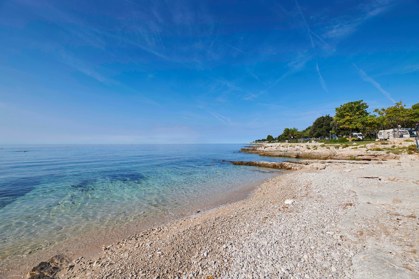Zdjęcie Ulika beach z powierzchnią beżowe kamyki