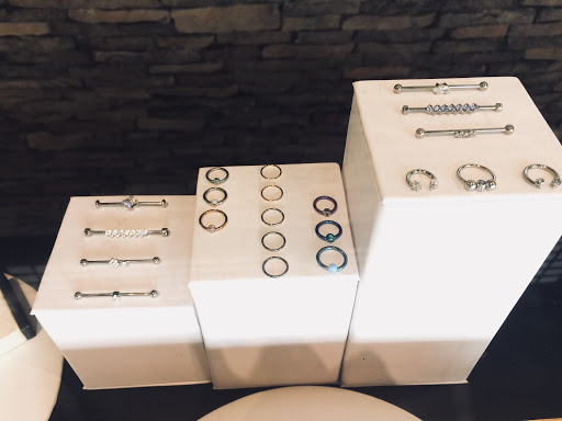 Explore december birth flower tattoo ideas, creative tattoo ideas in Addison, available at Cat Tattoo