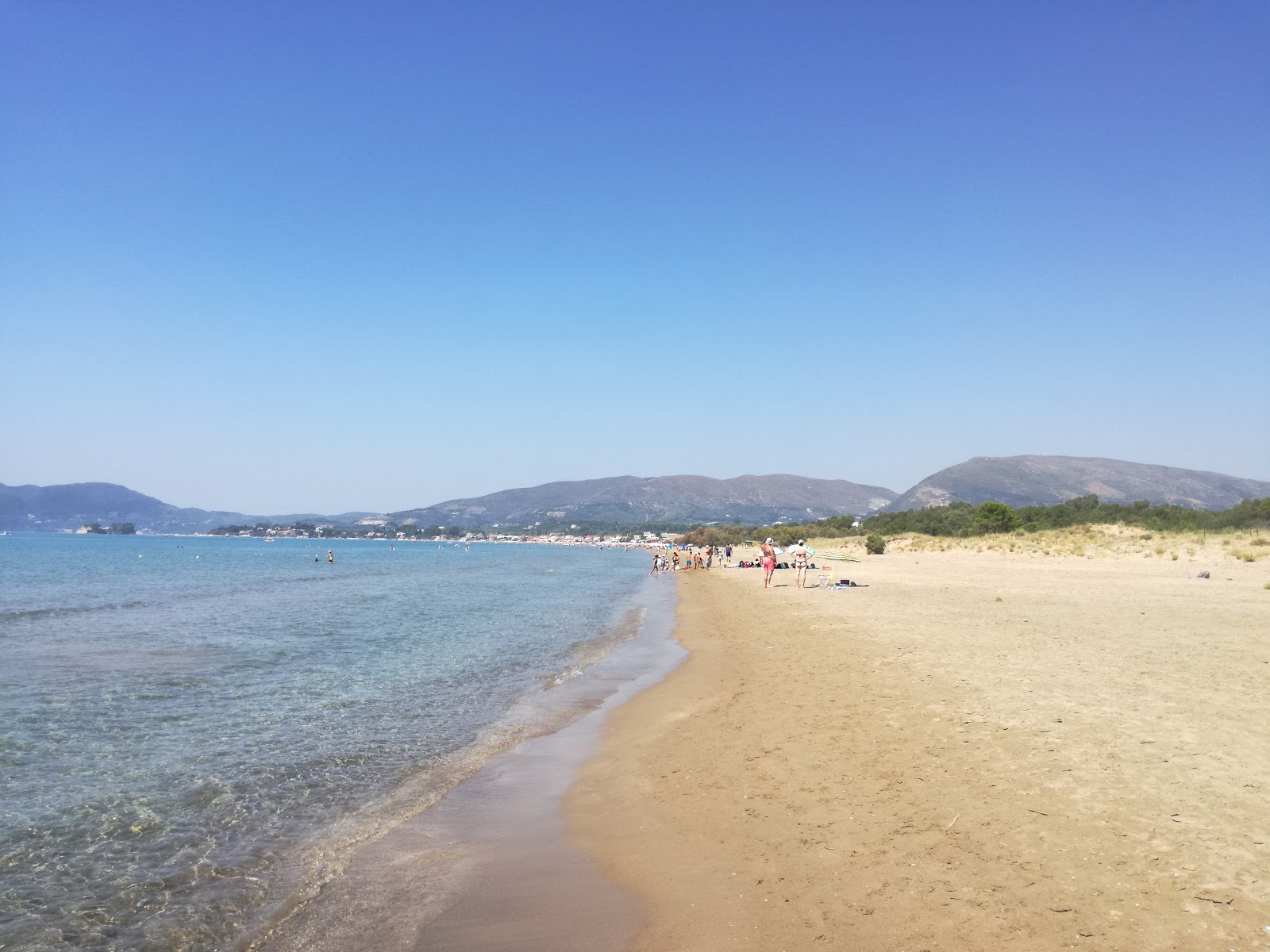 Fotografie cu Laganas Beach cu o suprafață de apa pură turcoaz