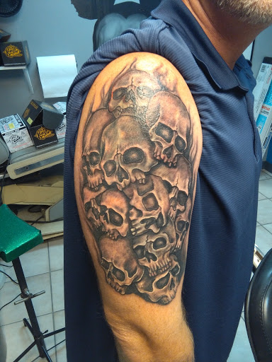 Explore kiss tattoo ideas, creative tattoo ideas in Bradenton, available at Memory Lane Tattoo Co.