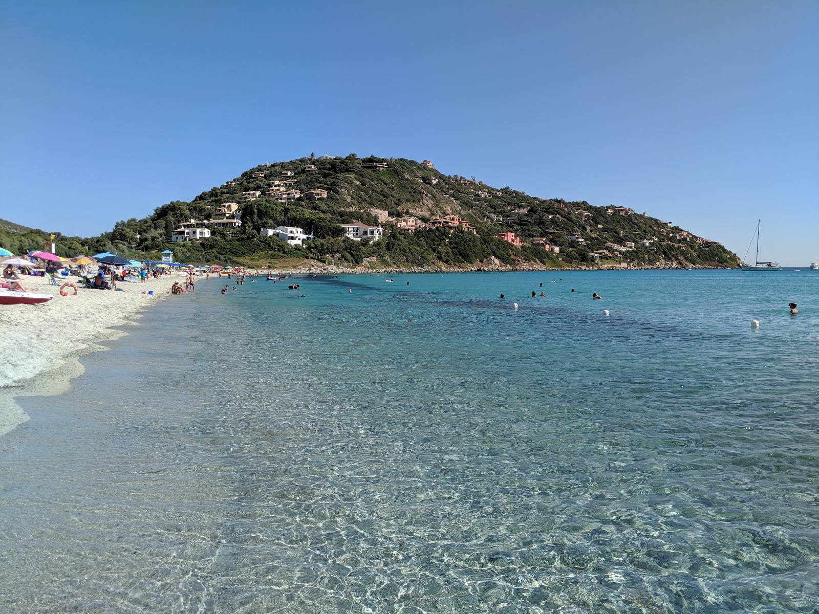 Foto av Spiaggia di Cann'e Sisa med blå rent vatten yta